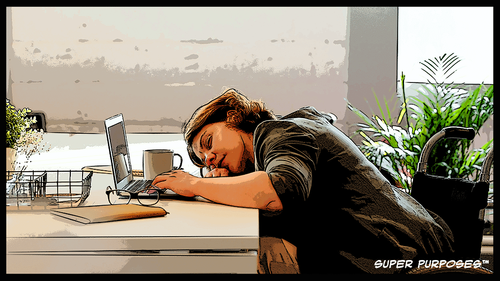 a job seeker sleeping at their computer desk