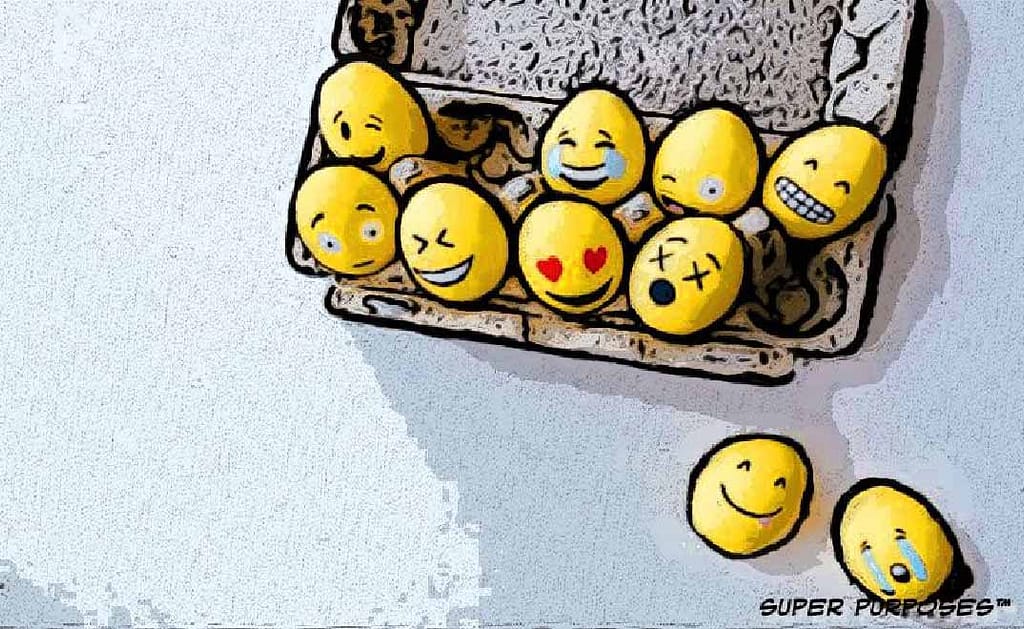 A crate full of eggs with social media emoji drawn on them